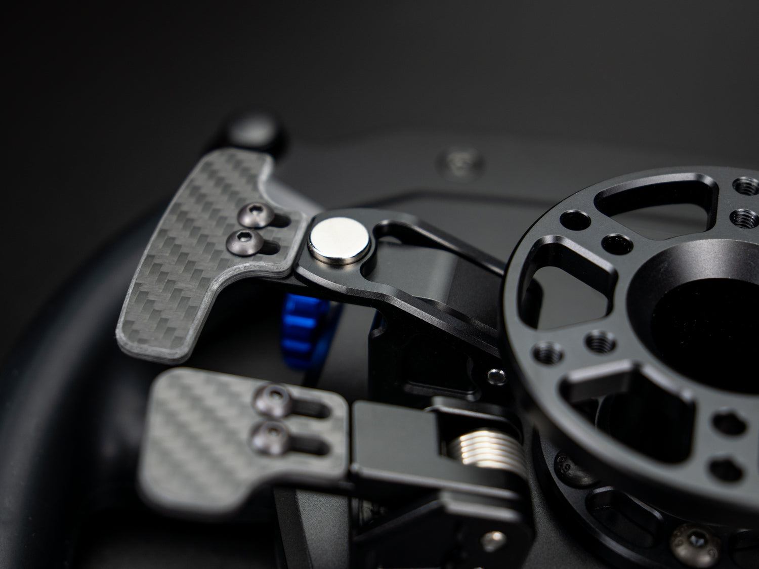 Aluminum shifter paddles on the LMPH V2 hypercar wheel with high-quality aluminum enclosurre